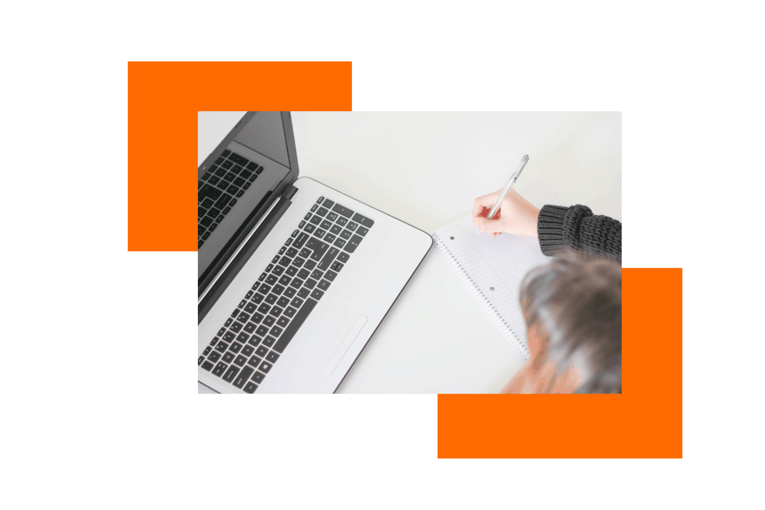 blogger with laptop writing on notepad