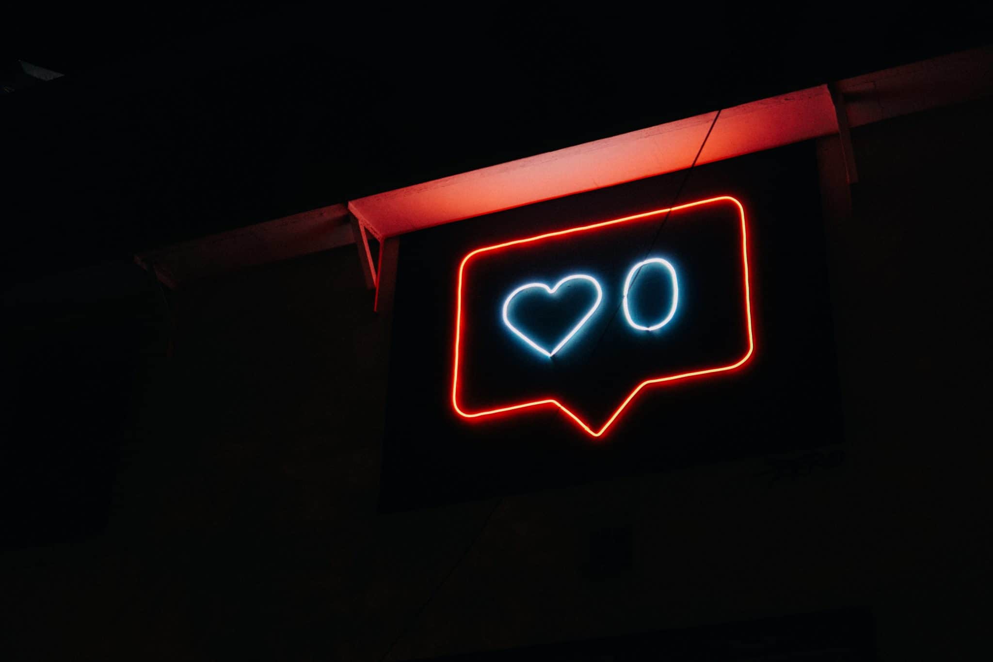 Neon sign in the shape of instagram likes