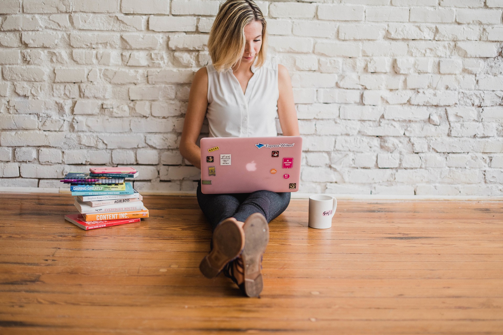 A picture of a girl on a laptop explaining some of The Benefits of Influencer Marketing