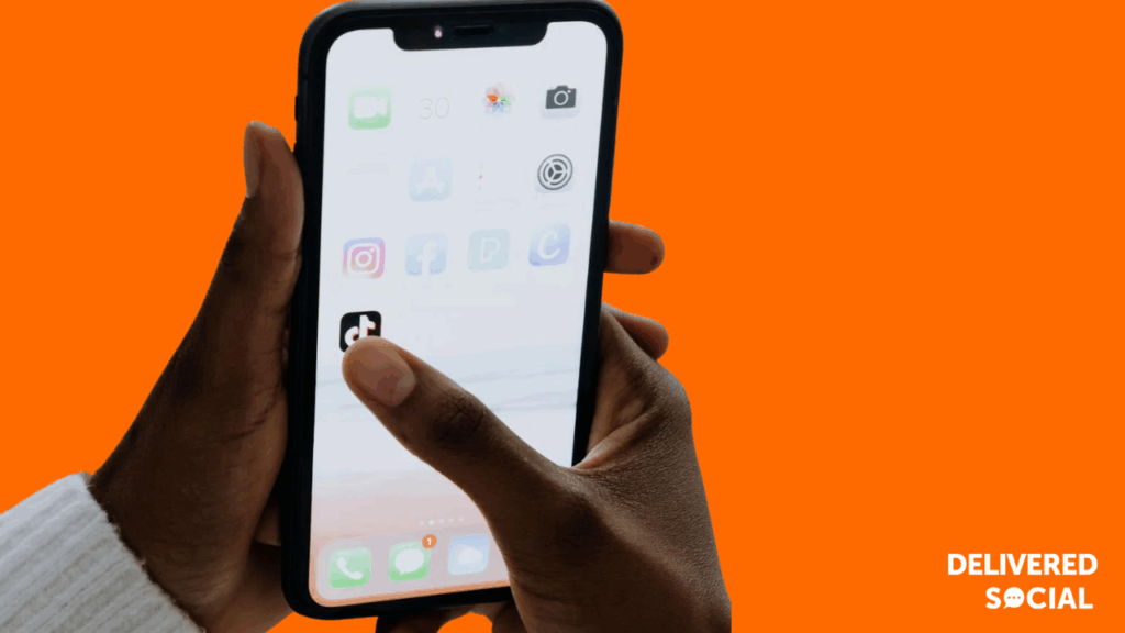 TikTok Account Banned and Blocked - Man holding Phone with TikTok on Screen