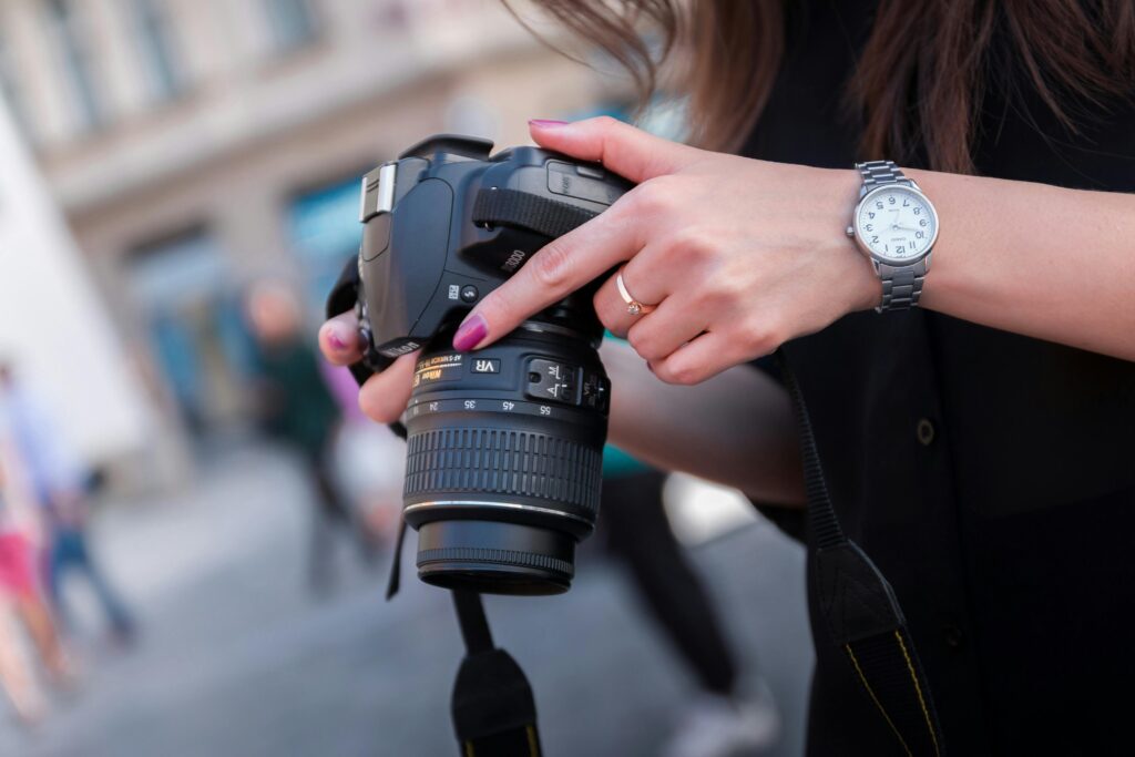photography-influencers-in-2025 - woman holding camera