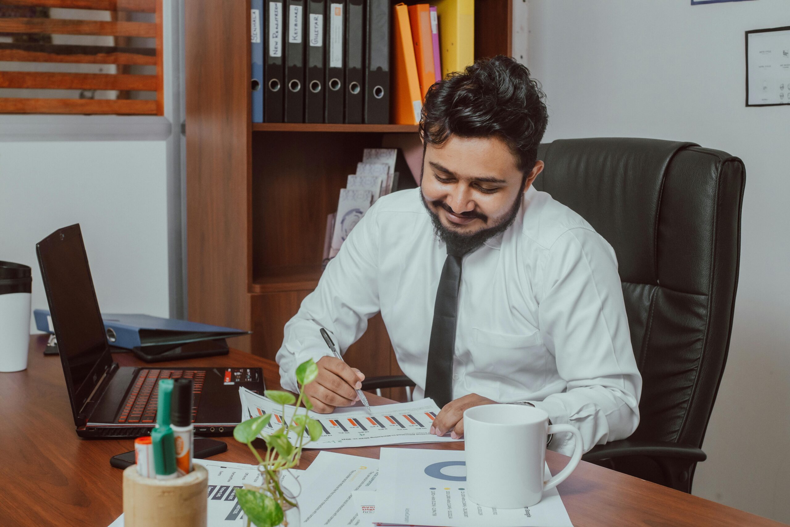 Man At Desk With Laptop in Dubai - Ecommerce Website Design Dubai