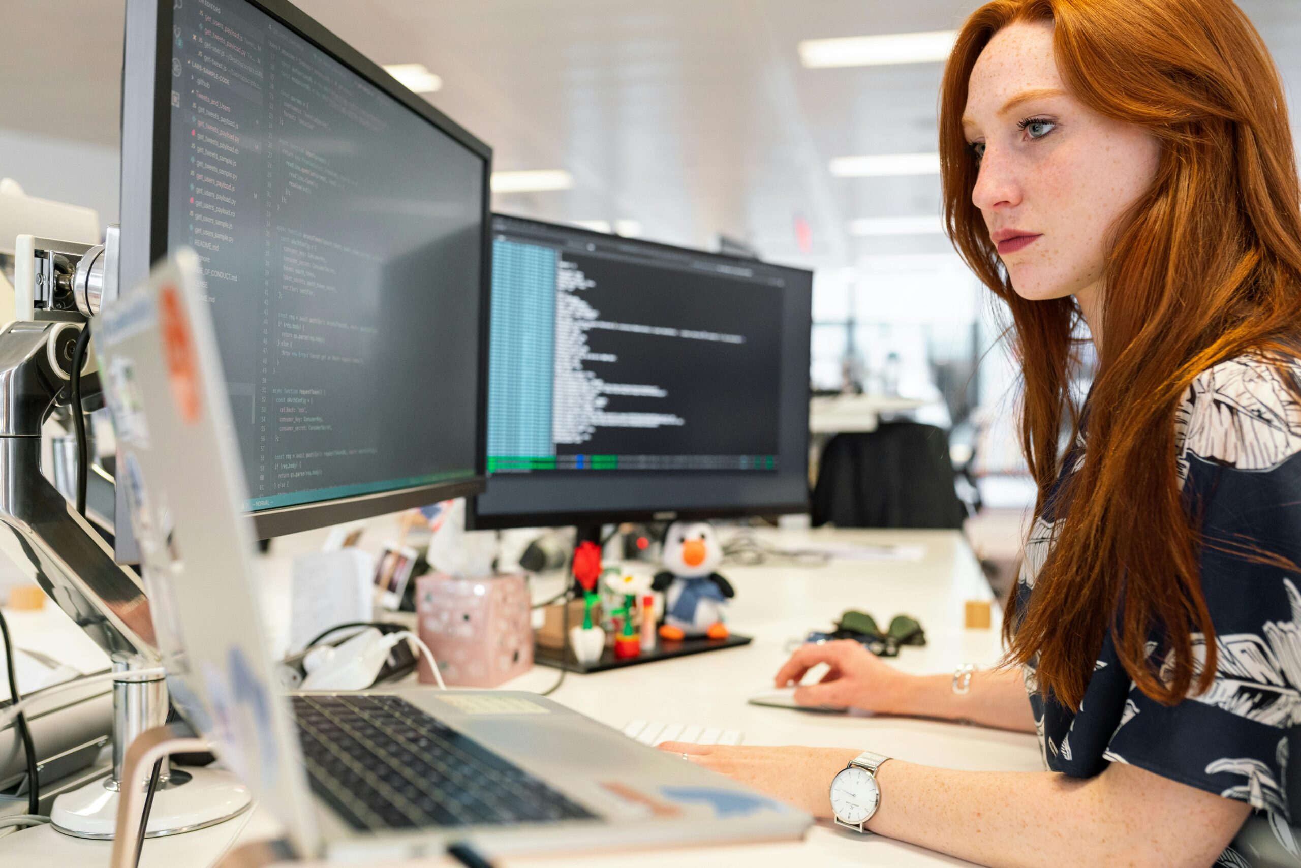 Popular Progressive Web App Tools - Lady Working at Desk With PCs