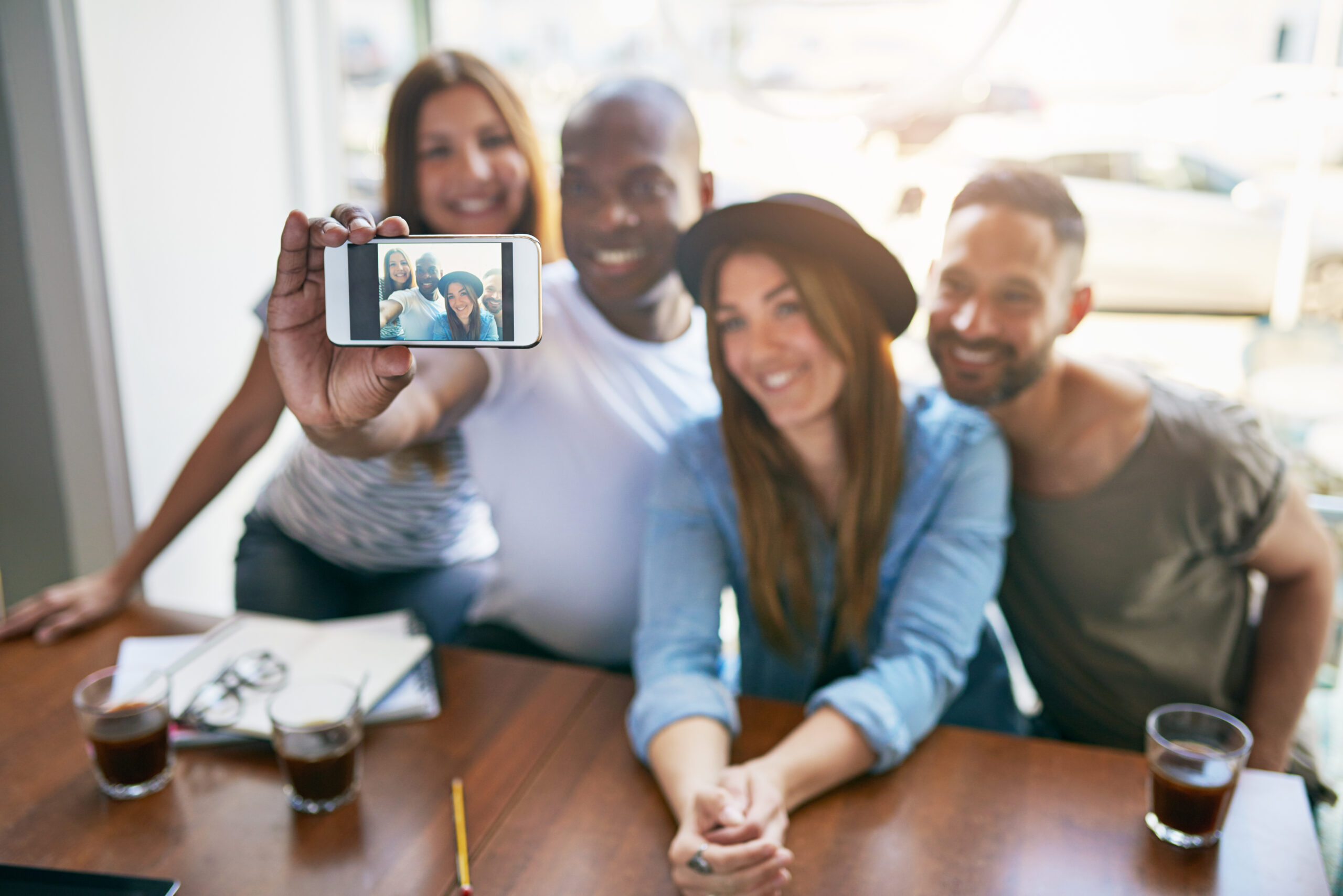 Smart-Tactics-to-Improve-Social-Media-Brand-Presence-Instantly-Group-taking-a-selfie-scaled.jpg
