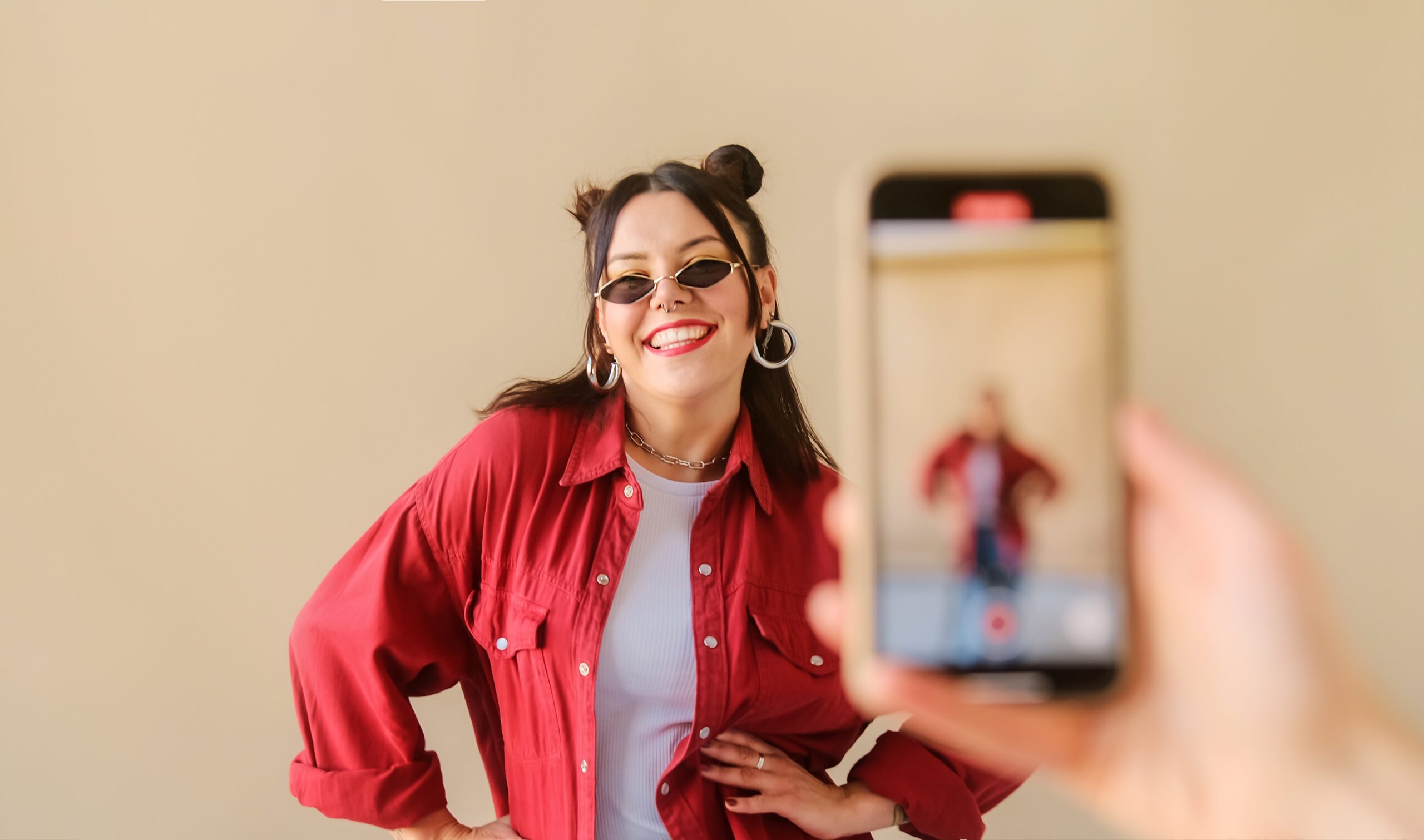 engage users on TikTok - woman recording tiktok