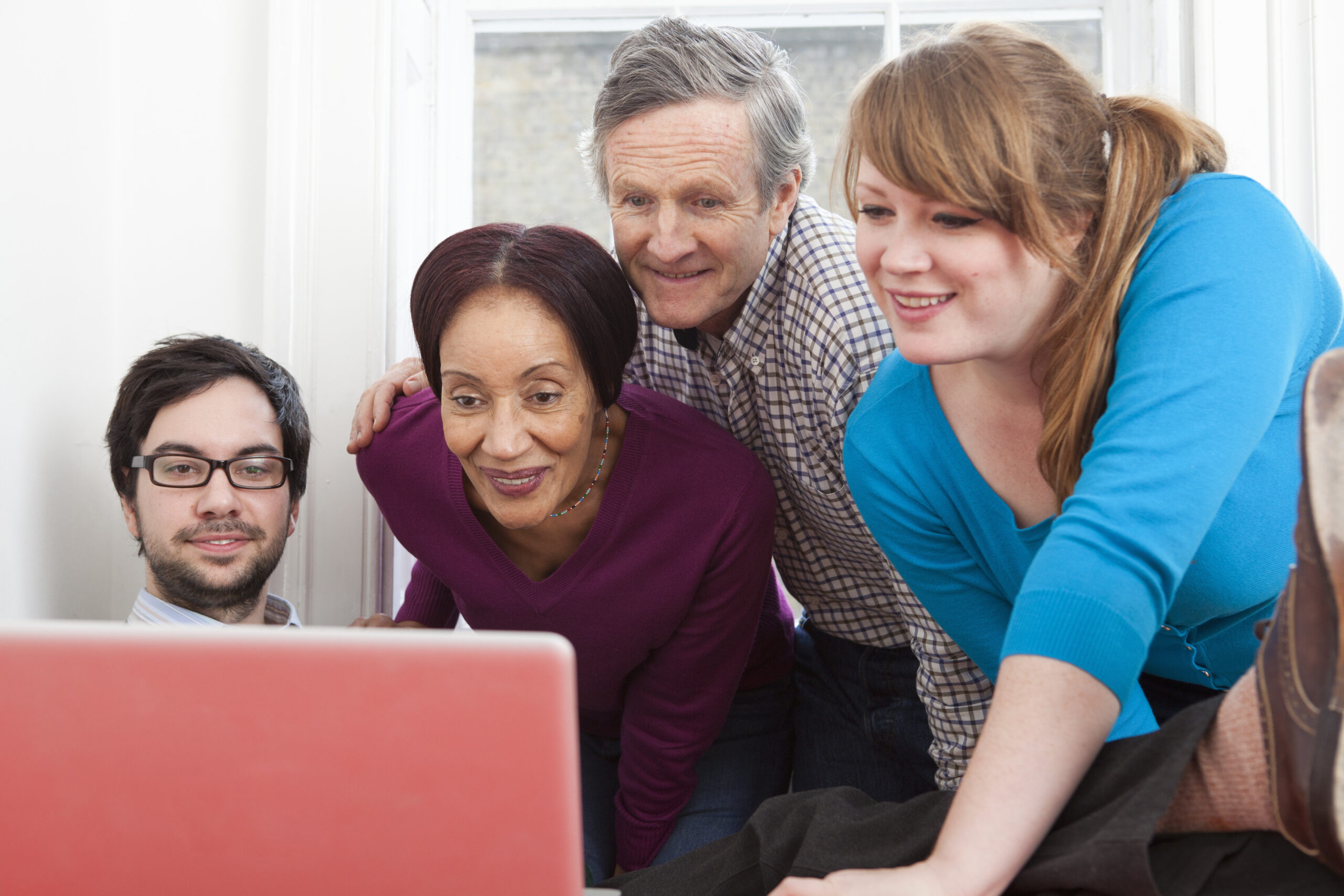 free-website-builders-for-charities-people-looking-at-website-scaled.jpg
