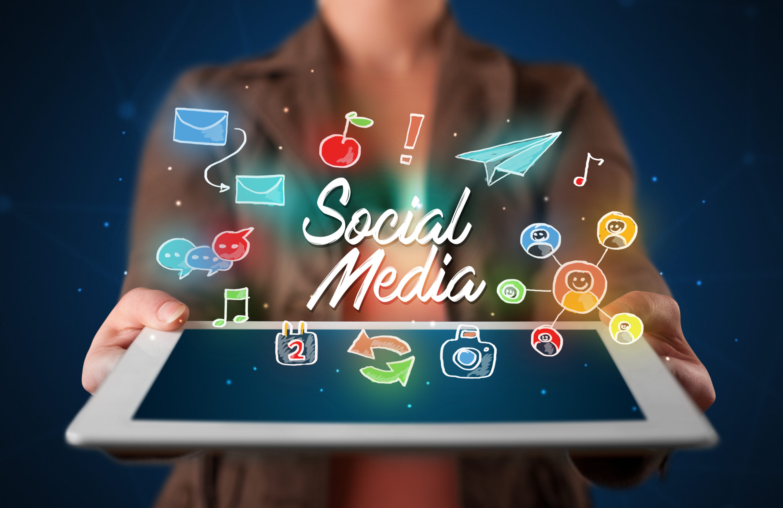 Avoid These Common Social Media Mistakes For Businesses - tablet held up with social media icons