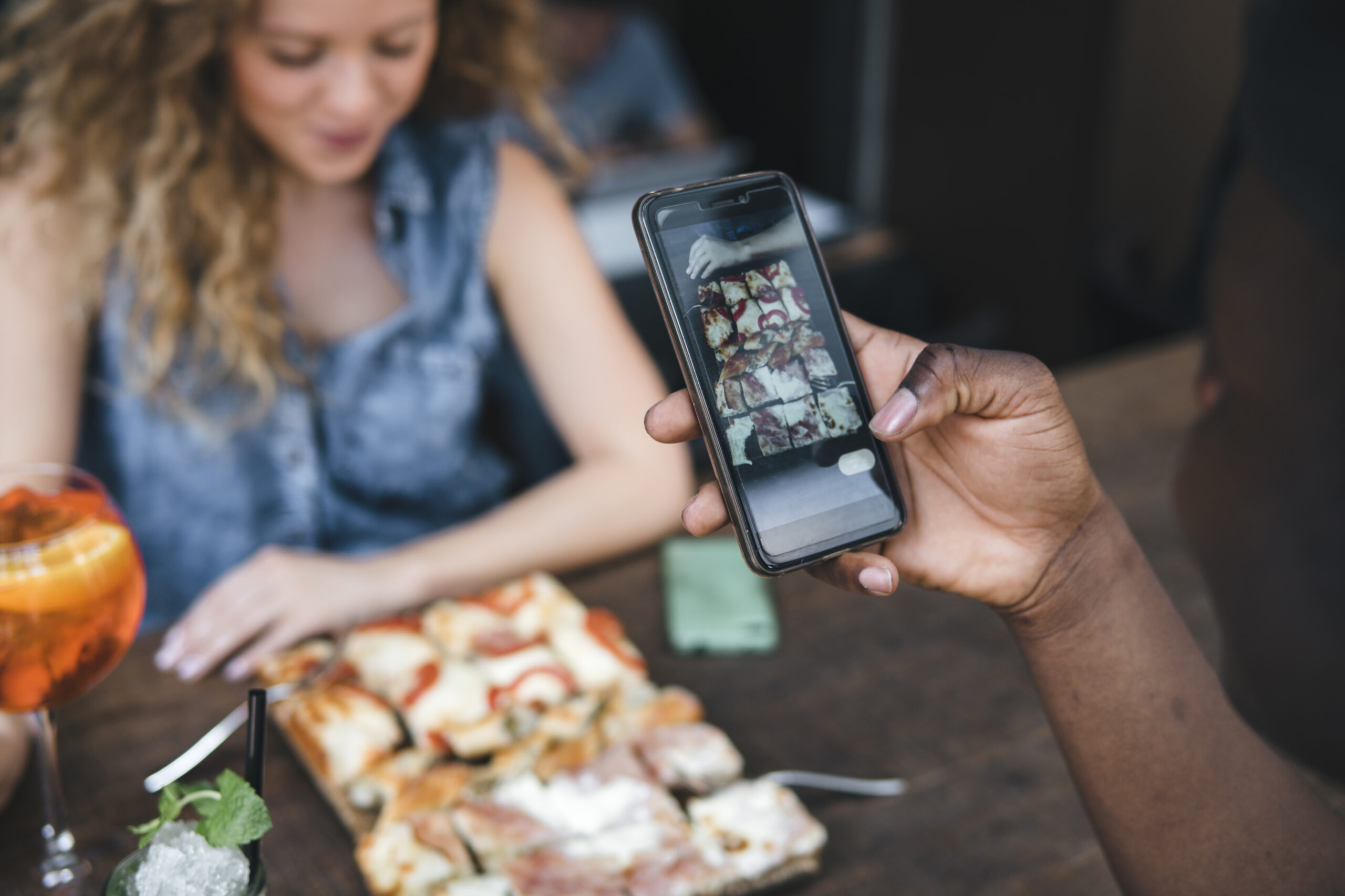 Build Community On Instagram Couple in Restaurant Taking Selfie