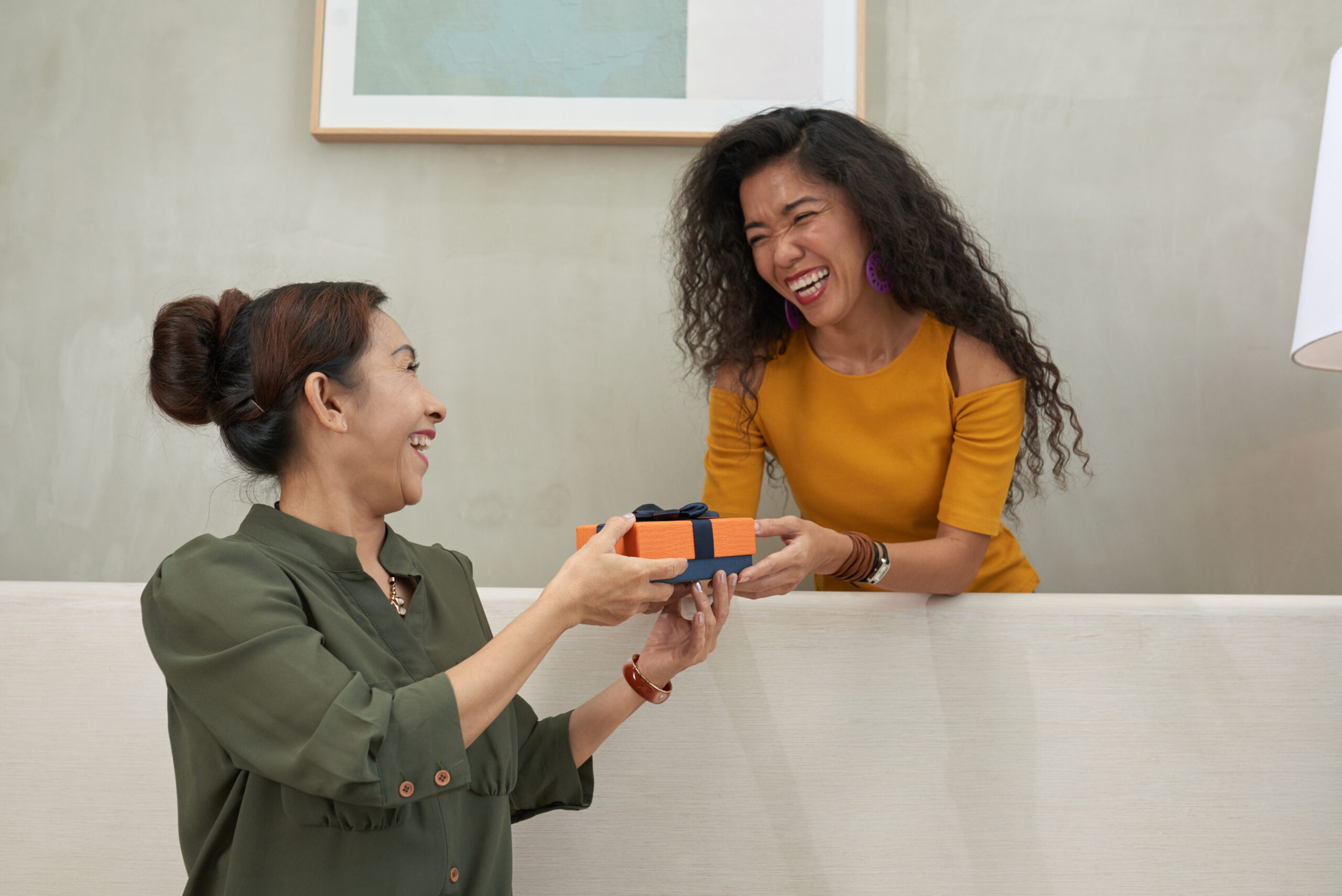 Creative Referral and Reward Ideas to Boost Customer Loyalty - waitress serving customer with loyalty card