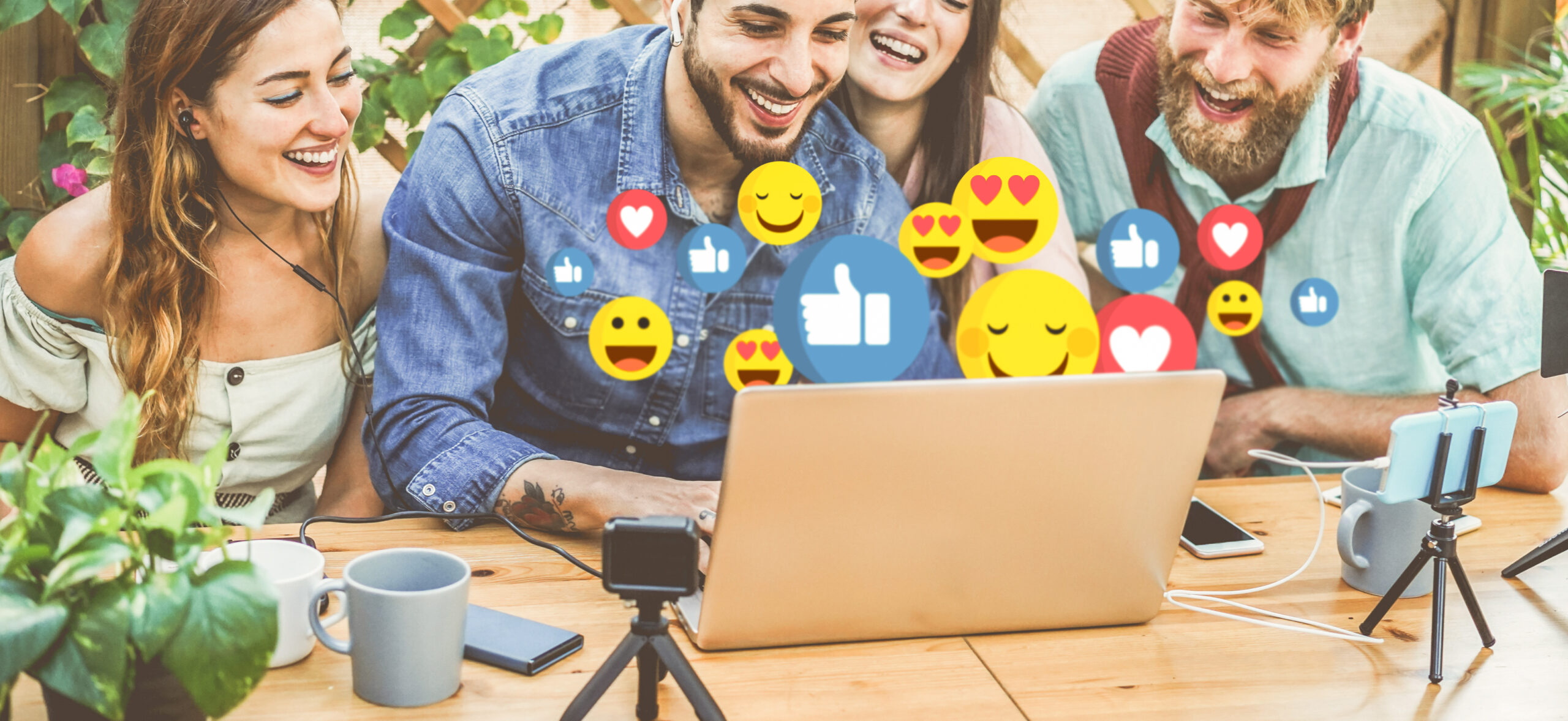 Facebook Marketing for Small Firms - young people on laptop with facebook reaction icons