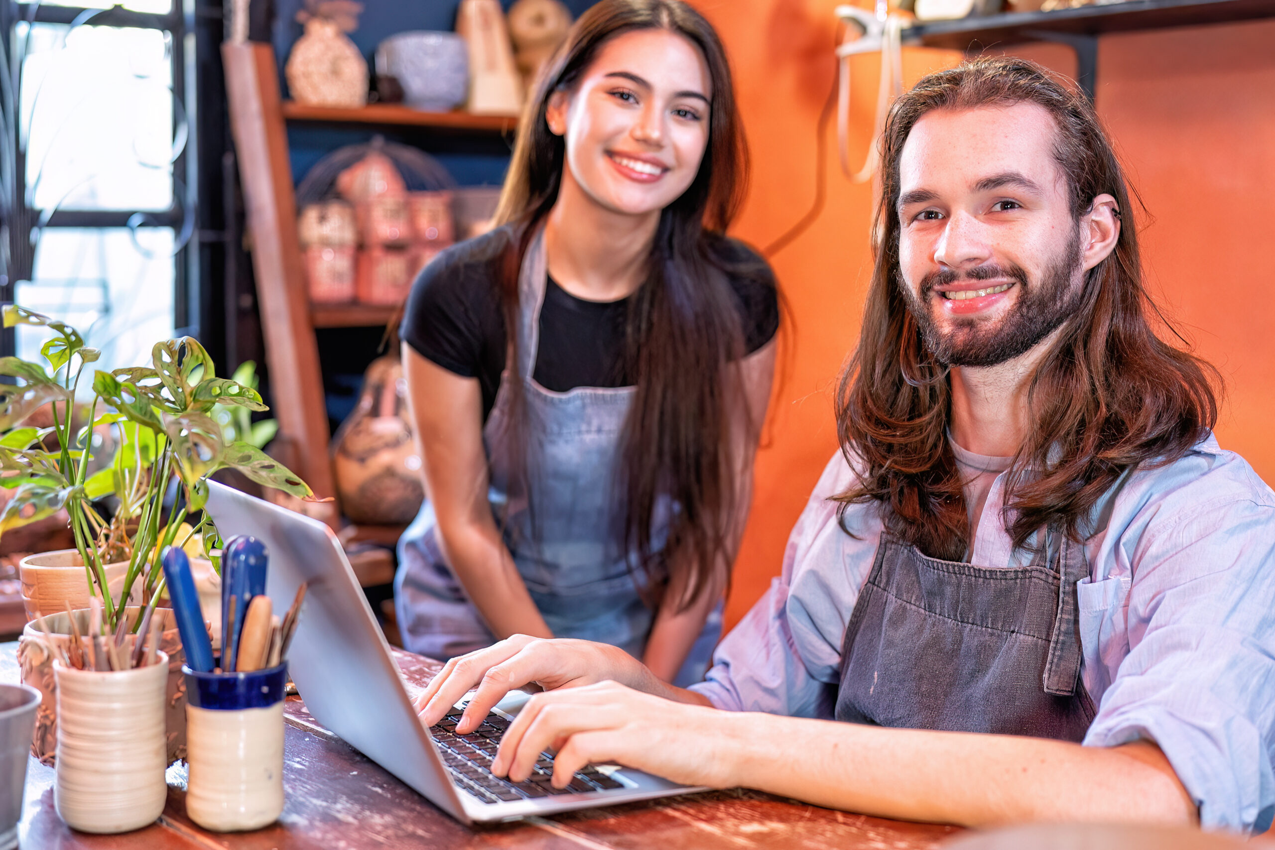 Local Help with Social Media for Growing Small Businesses In the UK - Colleagues shaking hands - business partners in pottery business