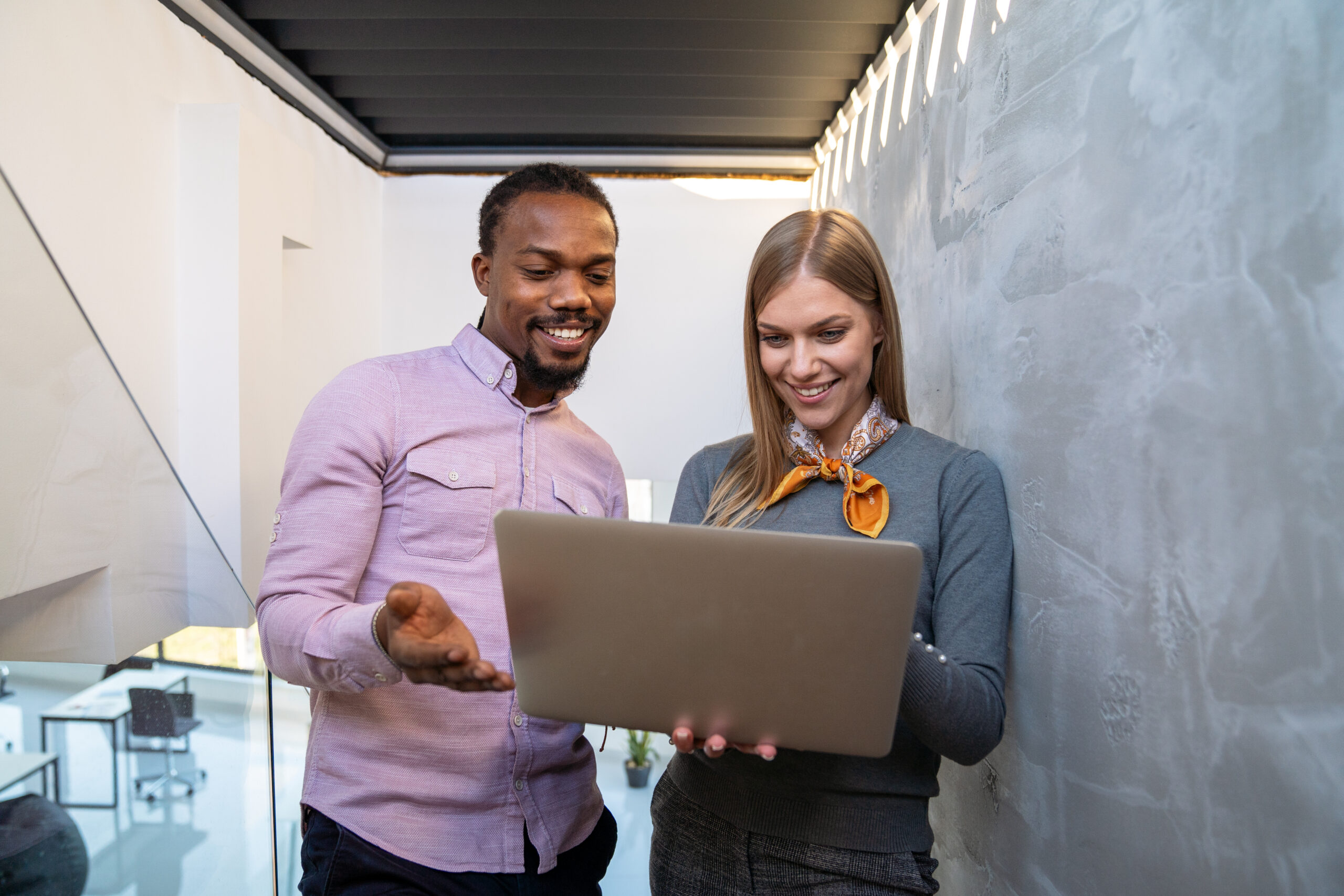 Switch Business Website Host Safely Without Losing Data & SEO Rankings - Business People looking at laptop