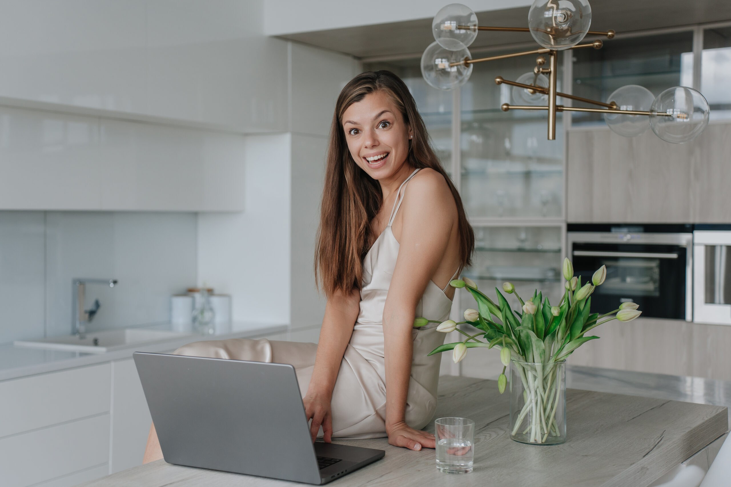 Top Picks for the Best Hosting for Business Website - Woman smiling with laptop