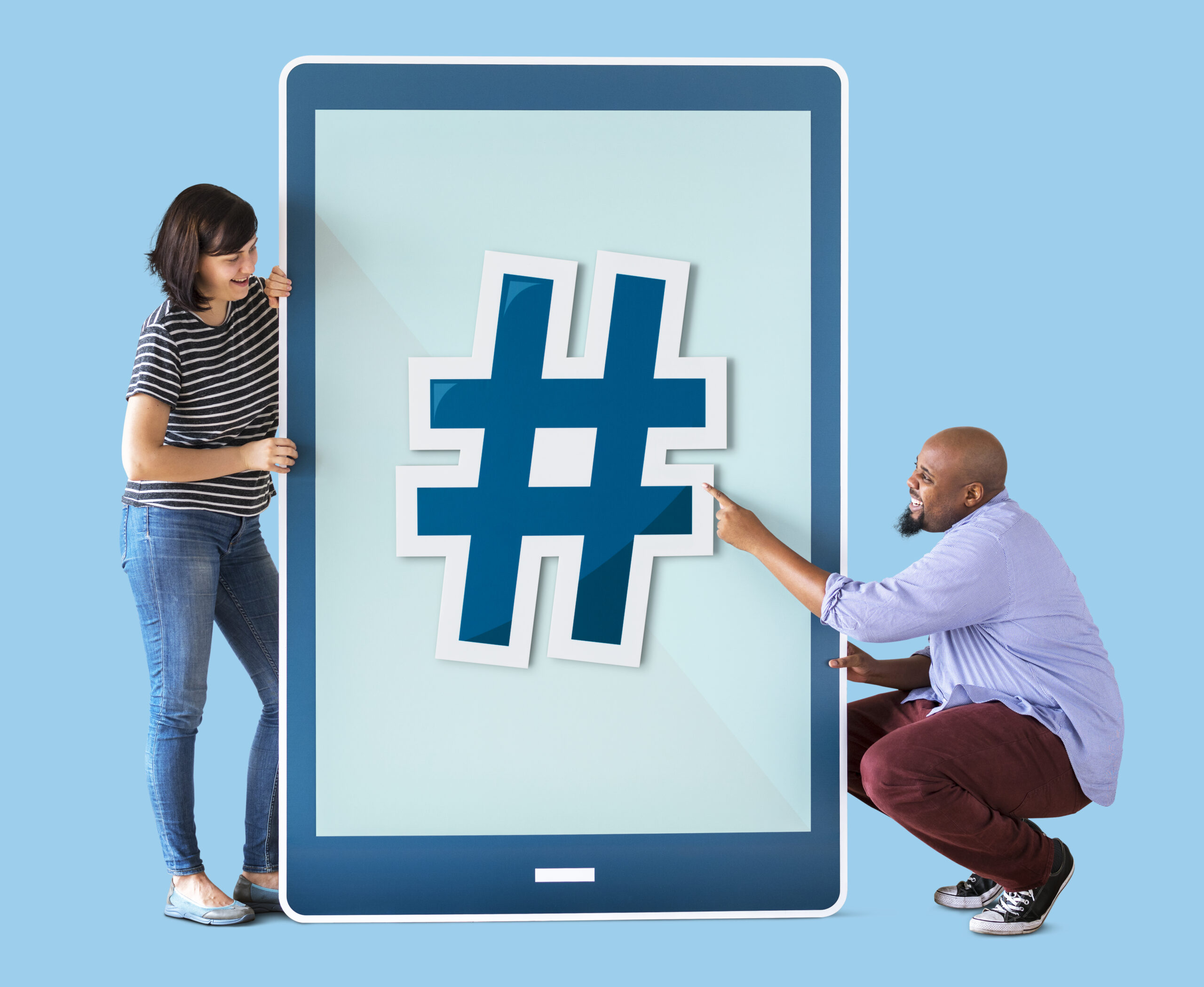 Top Tips to Use Hashtags Effectively and Expand Your Reach - friends holding ipad displaying hashtag