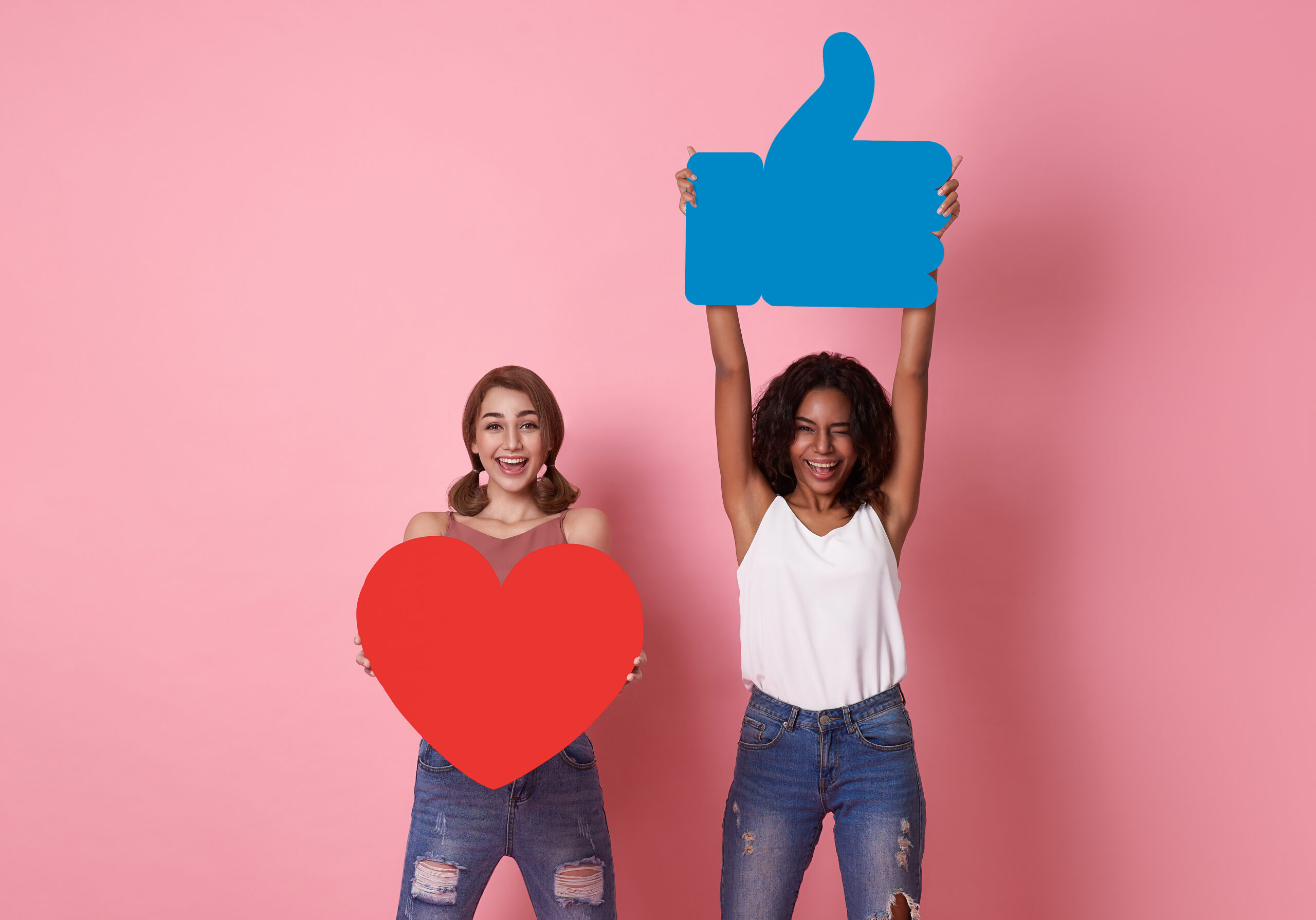Analytics Tools for Facebook Pages to Enhance Your Social Media Strategy - cheerful woman holding hearts and thumbs up icons