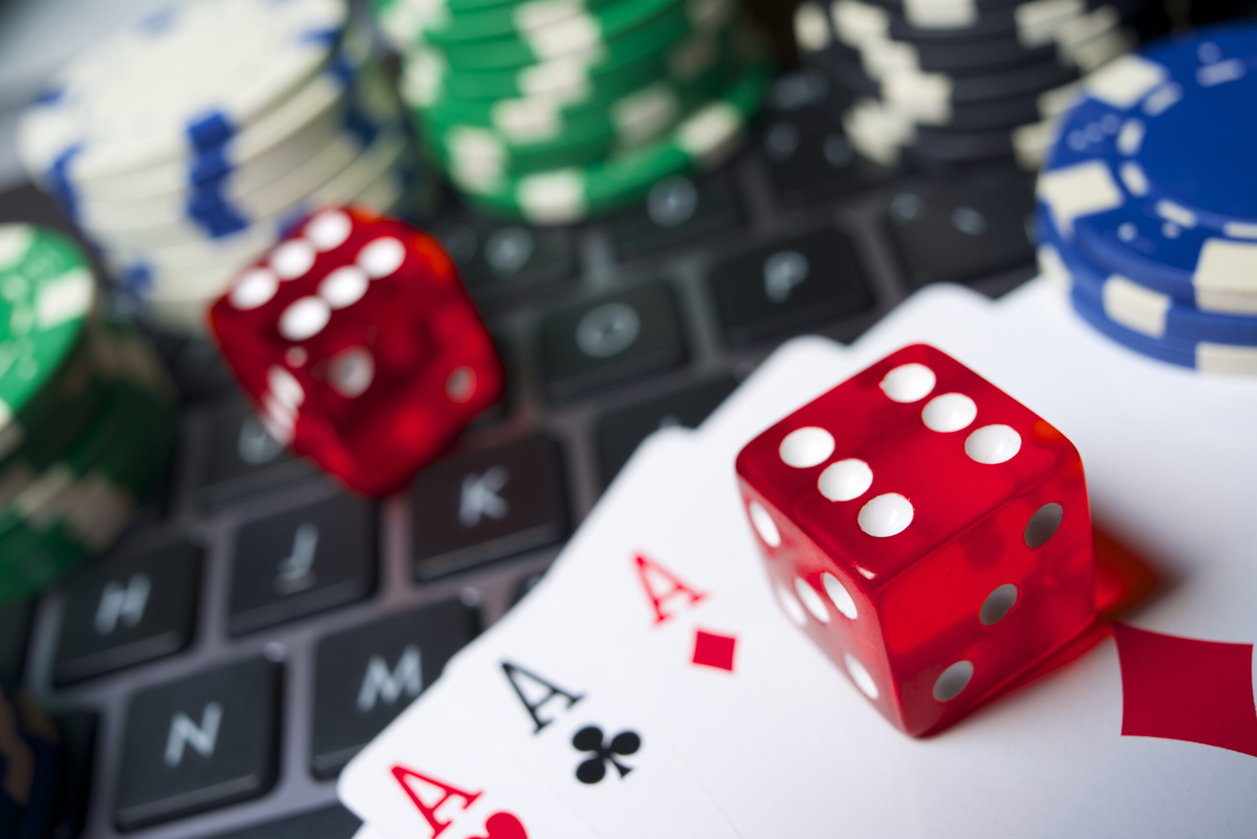 Email Marketing for Casinos - How To Enhance Player Retention - casino chips on laptop