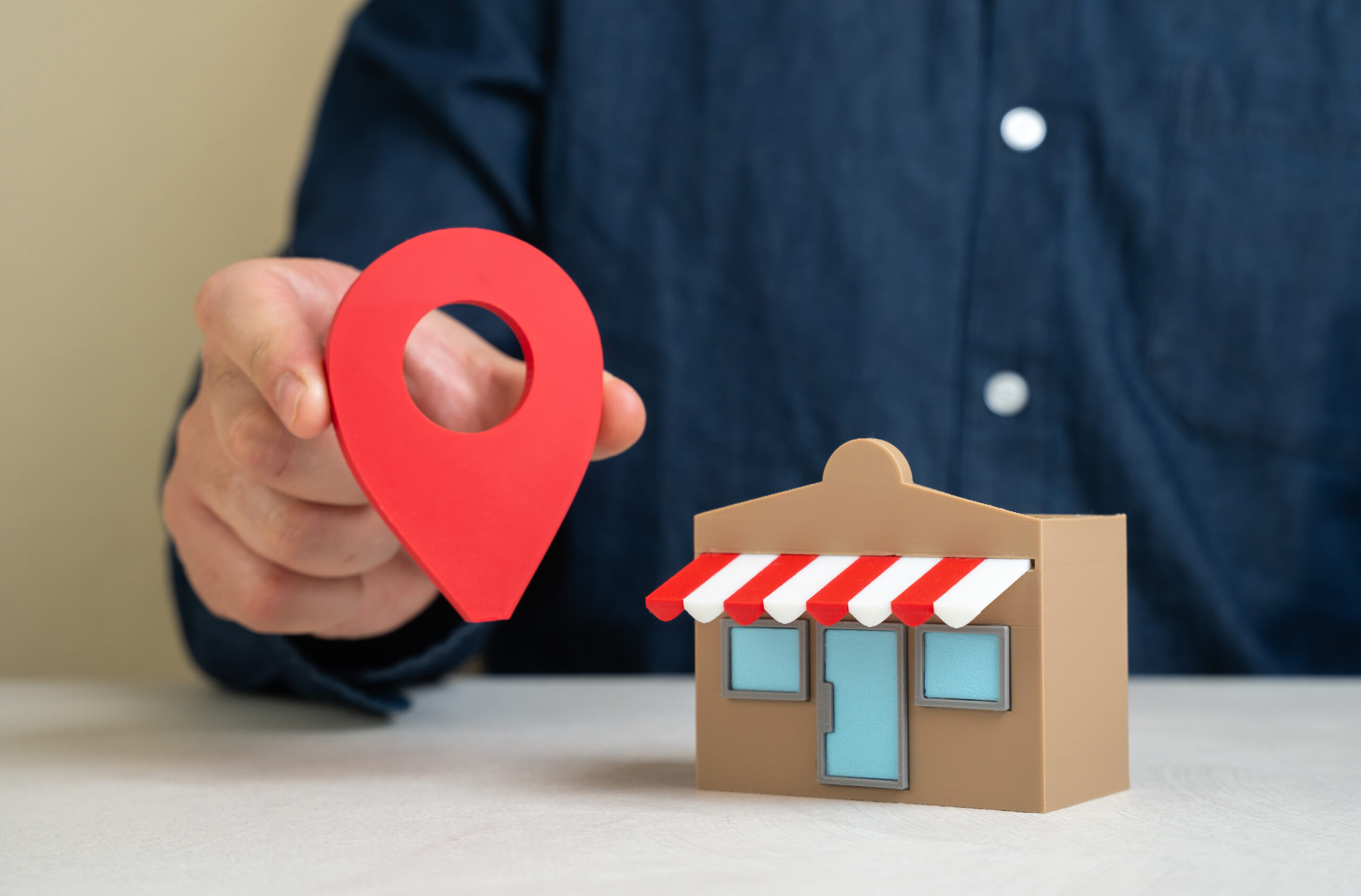Expert Geo Location Tracking Services Tailored for UK Businesses - man holding geolocation pin.