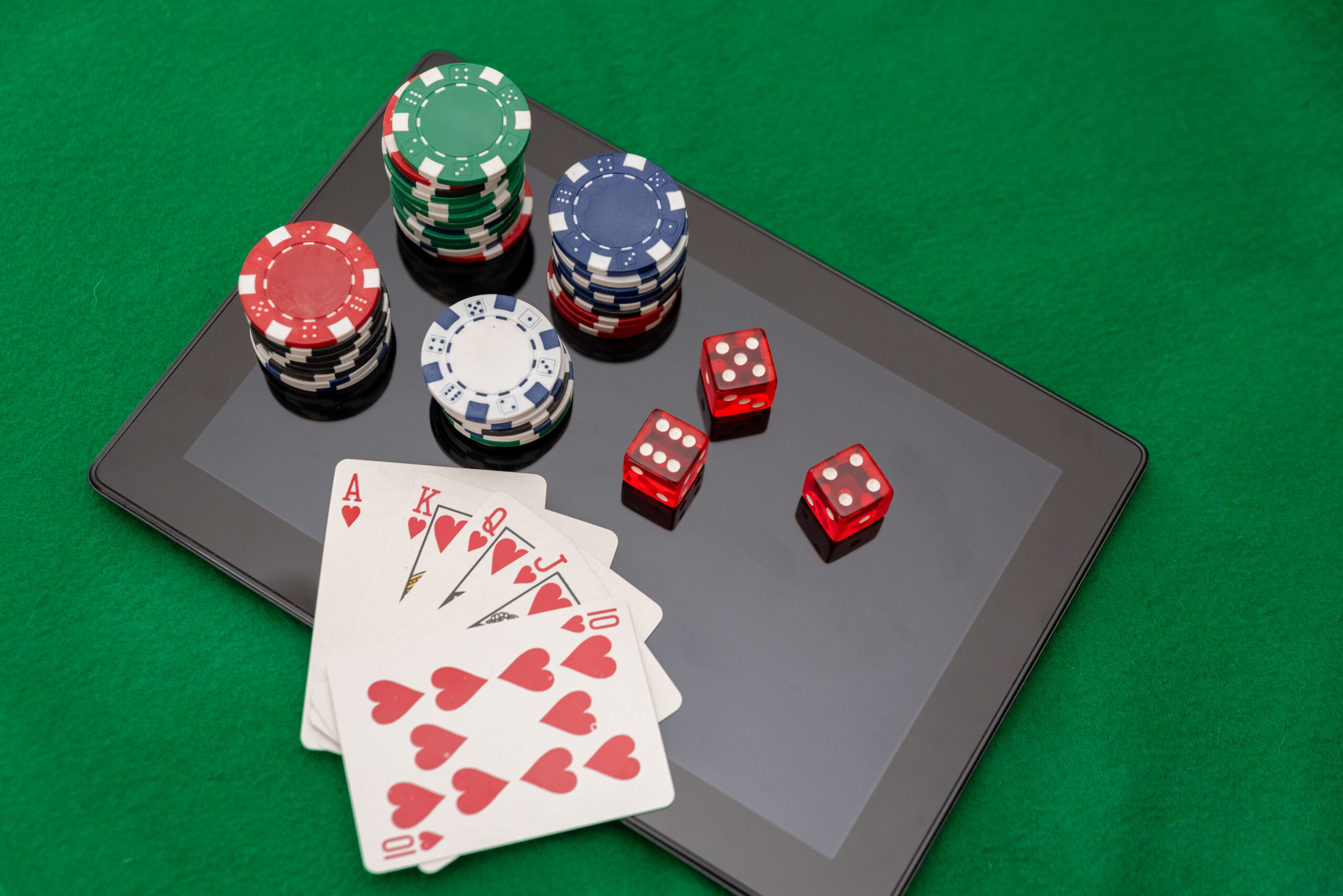 How Gamification in Casino Marketing Enhances Player Engagement and Loyalty - card and chips on ipad