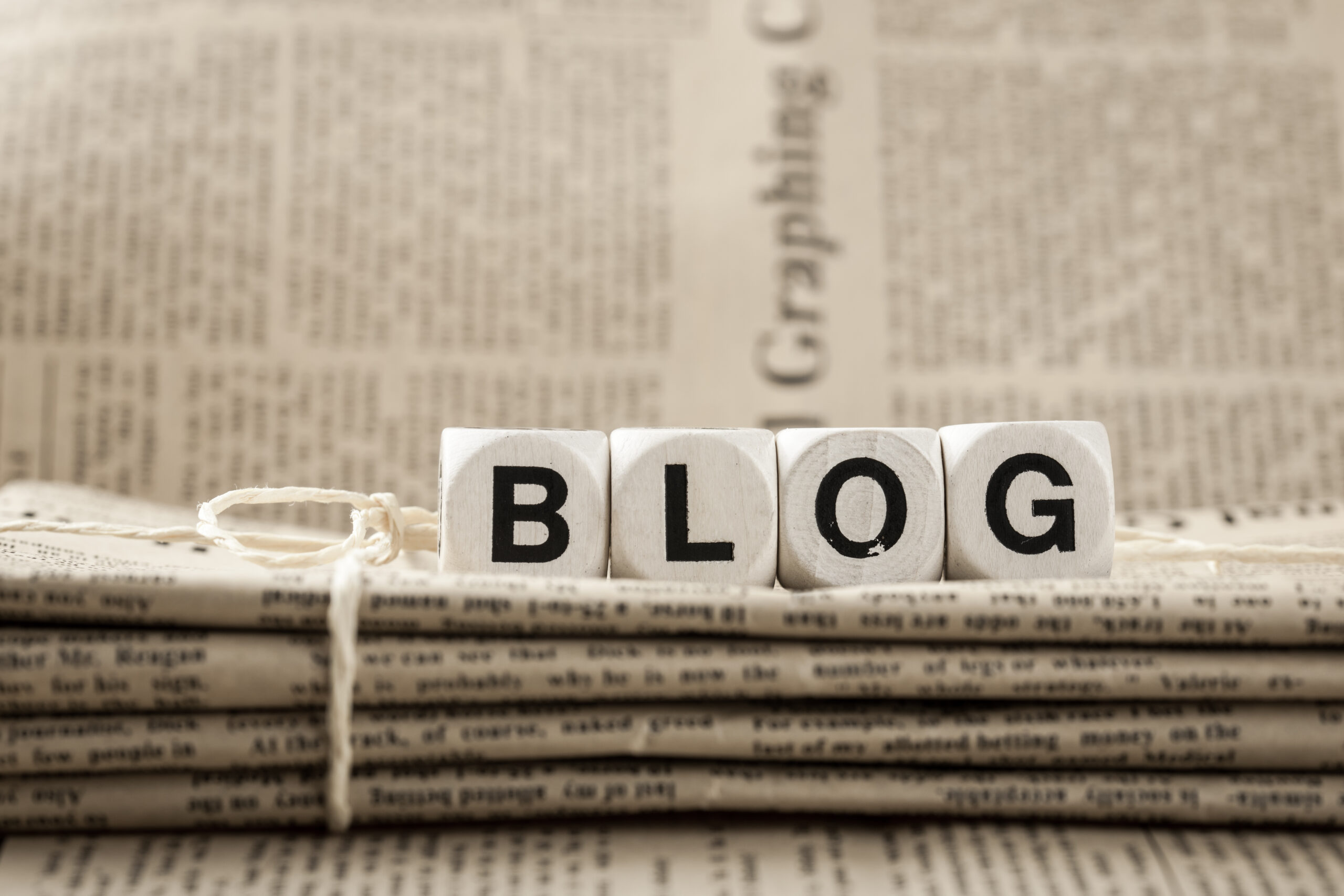 How to Start Blogging - A Beginner’s Guide to Create Your Blog Today - blog tile on newspaper