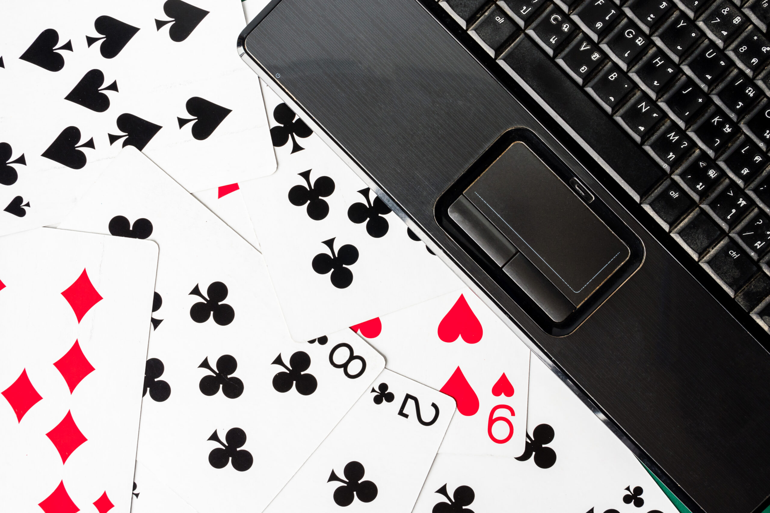 Proven Tactics in Email Marketing for Casino Retention - laptop and playing cards