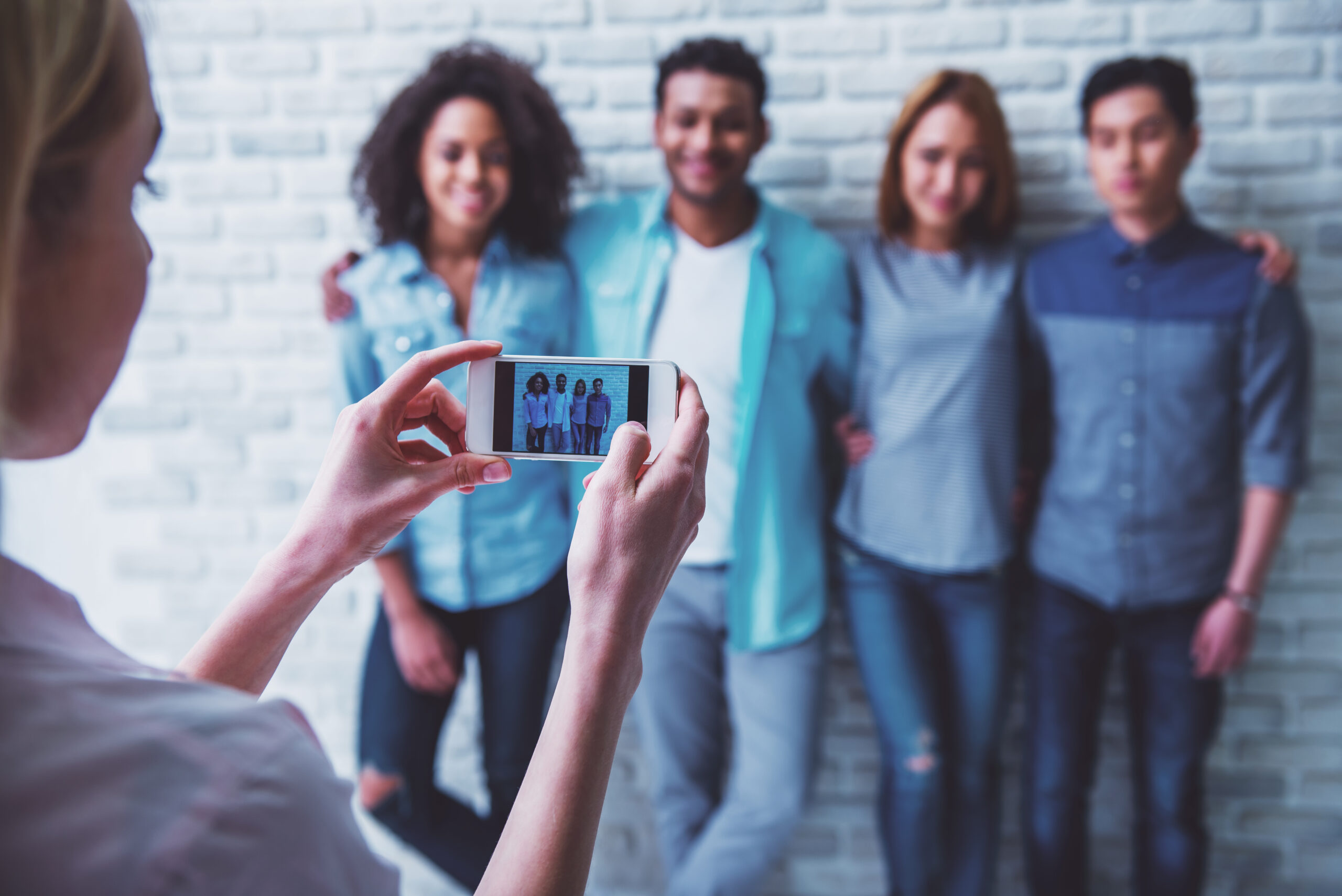 What to Post Daily - Simple Ideas to Keep Your Social Media Feed Fresh - young people with iphone