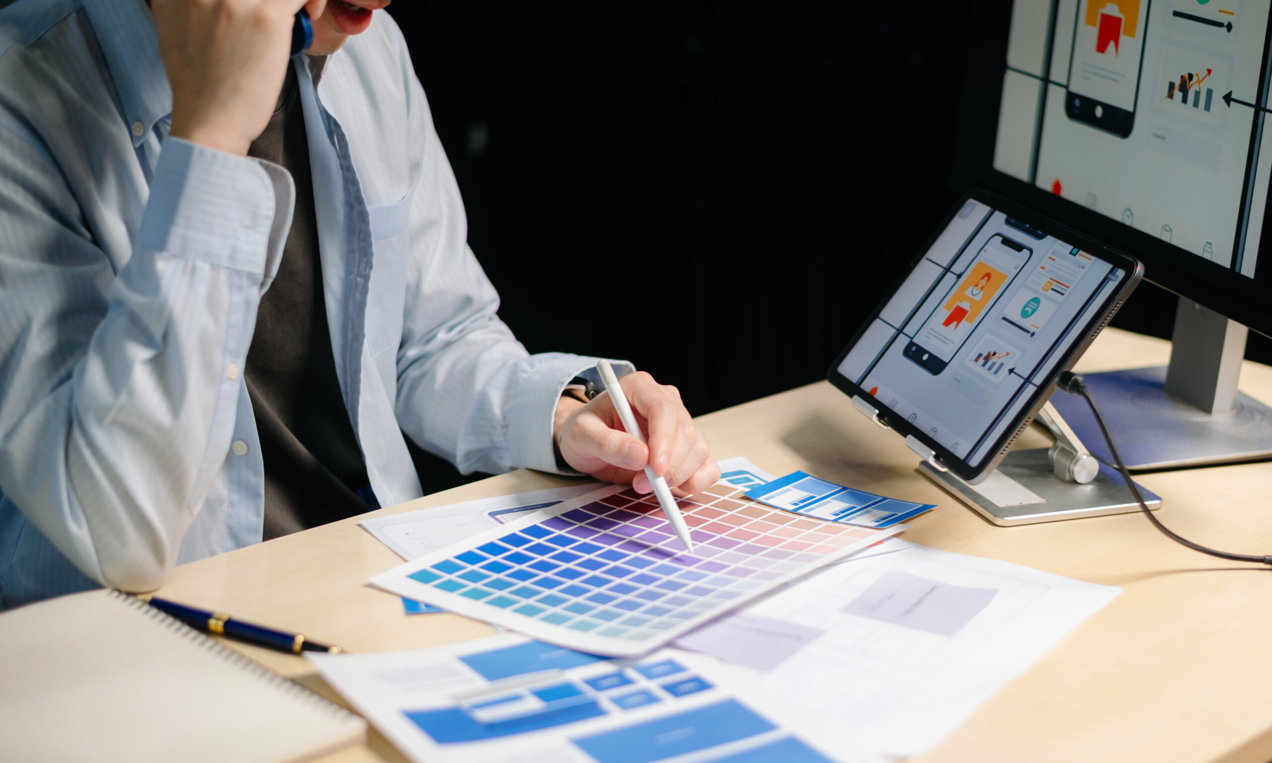 Web designer reviewing design colours for a website to be nominated in to the Webby Awards