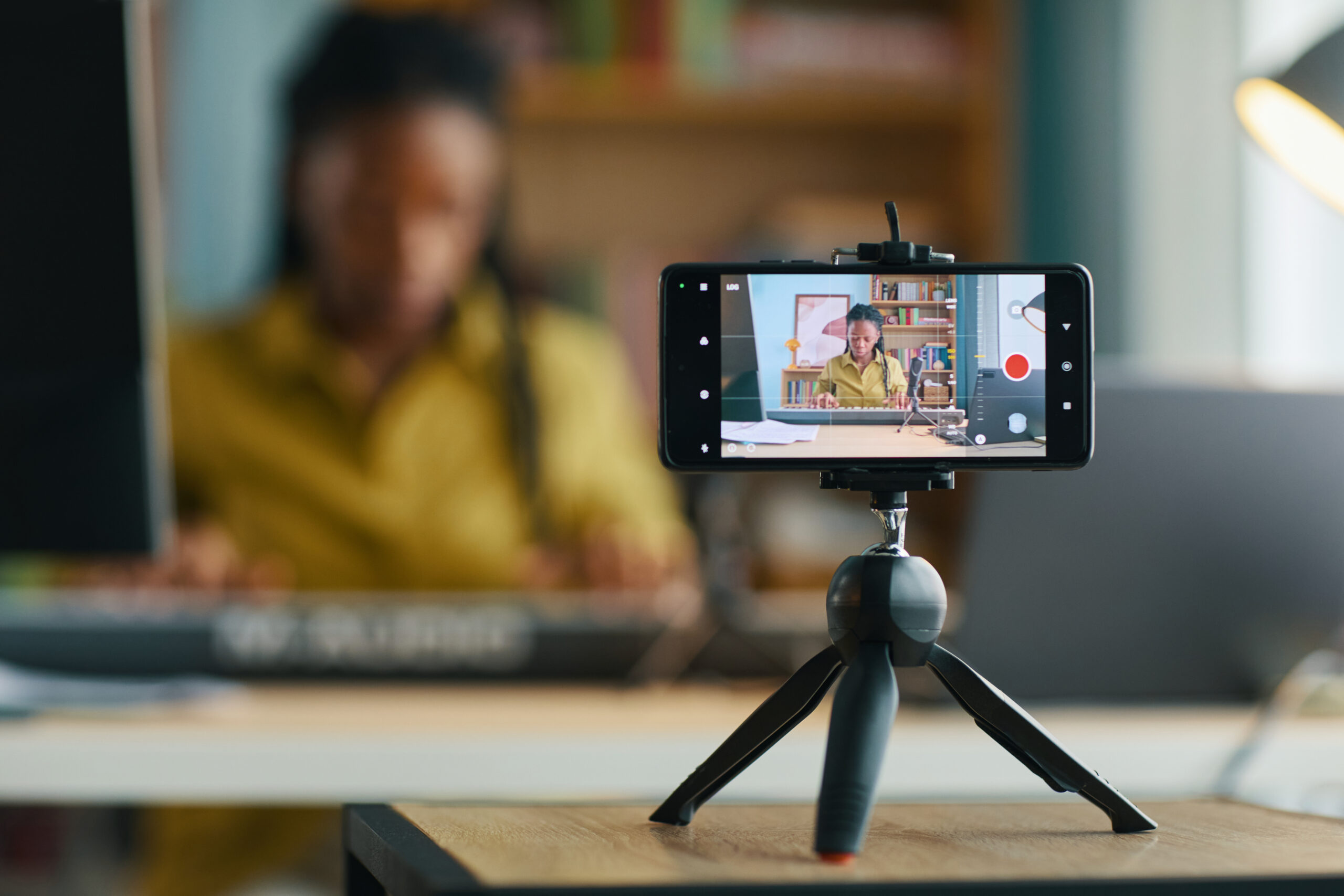 Ad Types on YouTube - A Clear Guide to Ads in YouTube Videos - recording smartphone on tripod.