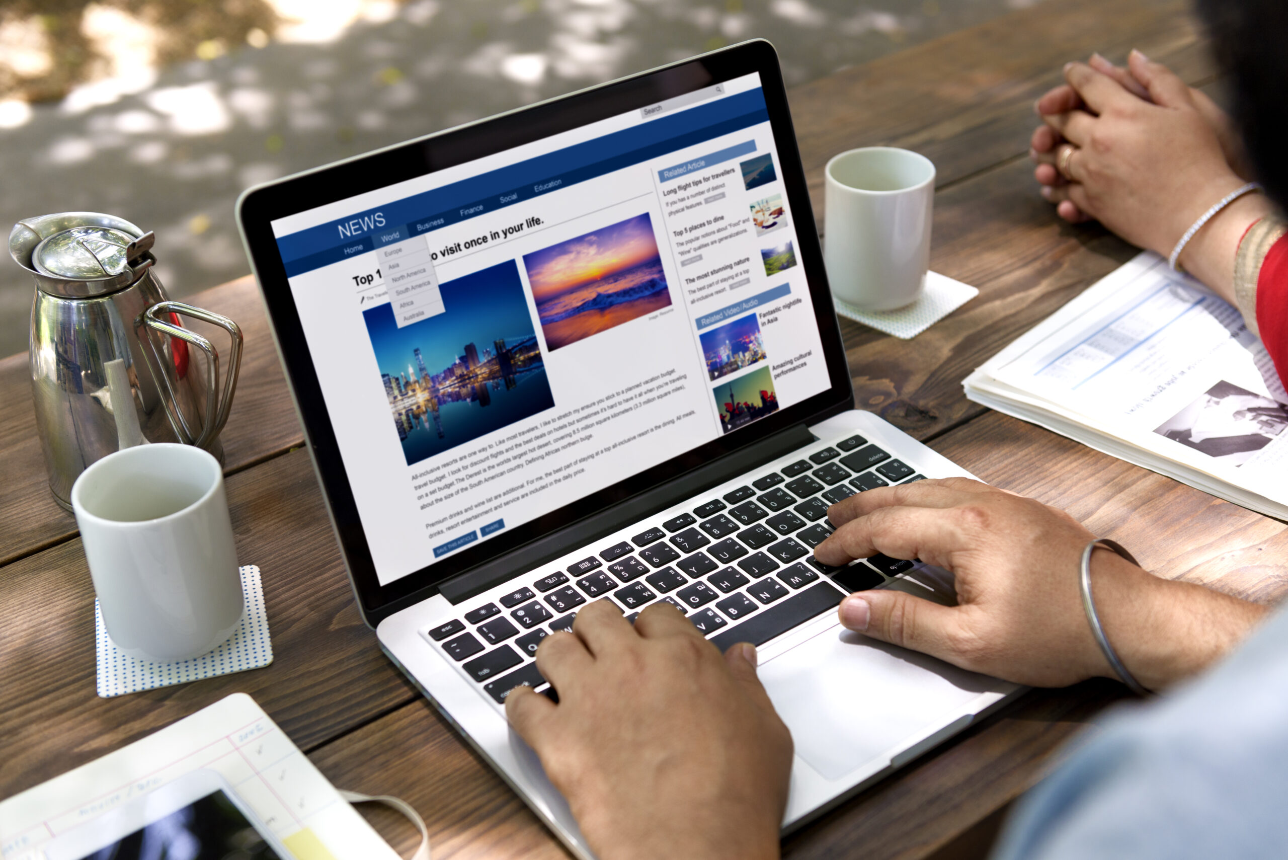 The Latest Figures - How Many People Use Facebook in The UK - couple using laptop