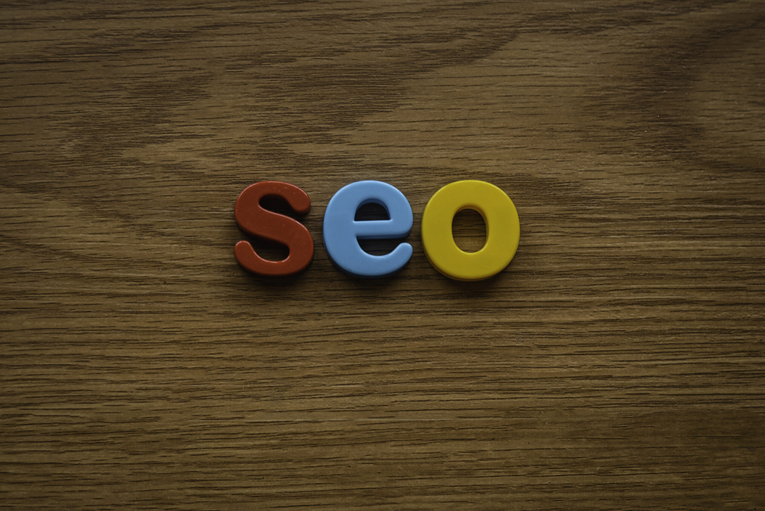 Top SEO Marketing Companies - SEO in block writing on wooden desk